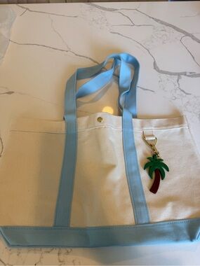 BaubleBar Cream Canvas Tote with Light Blue Straps and Palm Charm